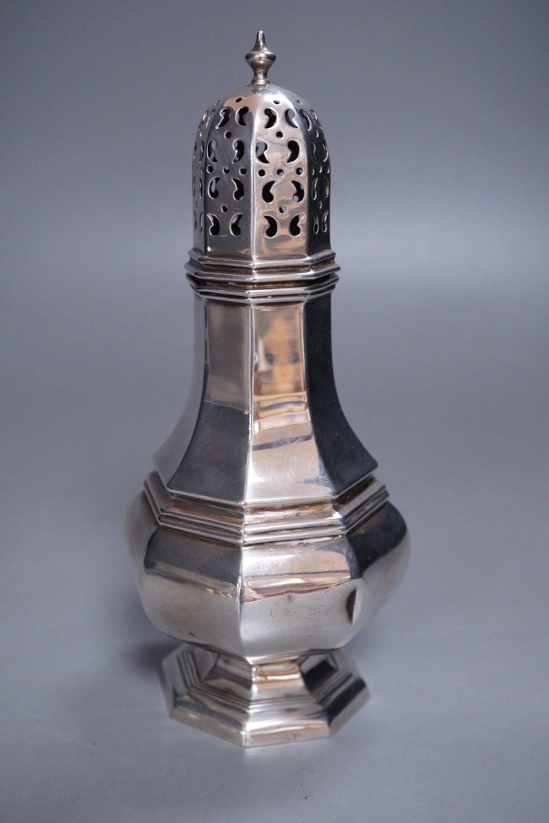 A George V silver octagonal sugar caster, Henry Wigfull, Sheffield, 1924, 18cm, 169 grams.
